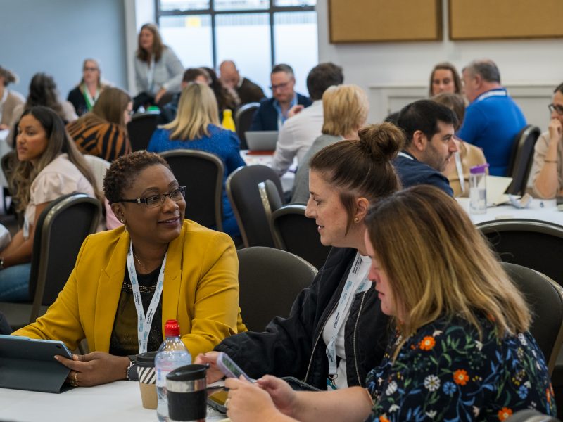 Careers staff in discussion at a round table as part of a regional meeting
