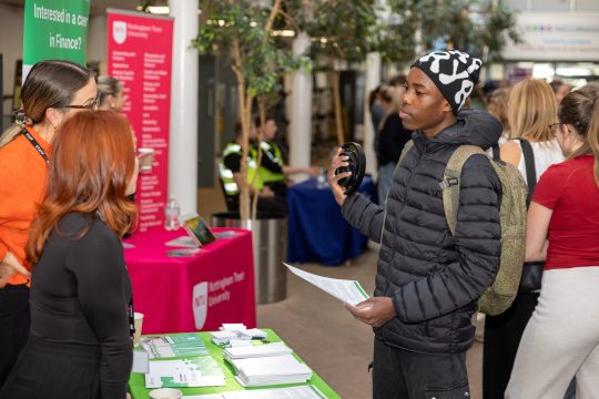 A student meeting an employer at a Meadowhead School careers event