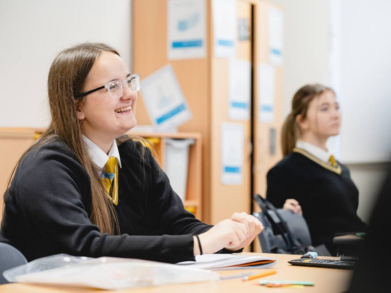 Kelsey smiling in the classroom