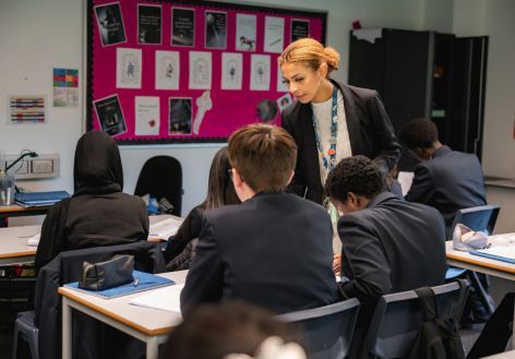 Geraldine with students sat at desks in a classroom